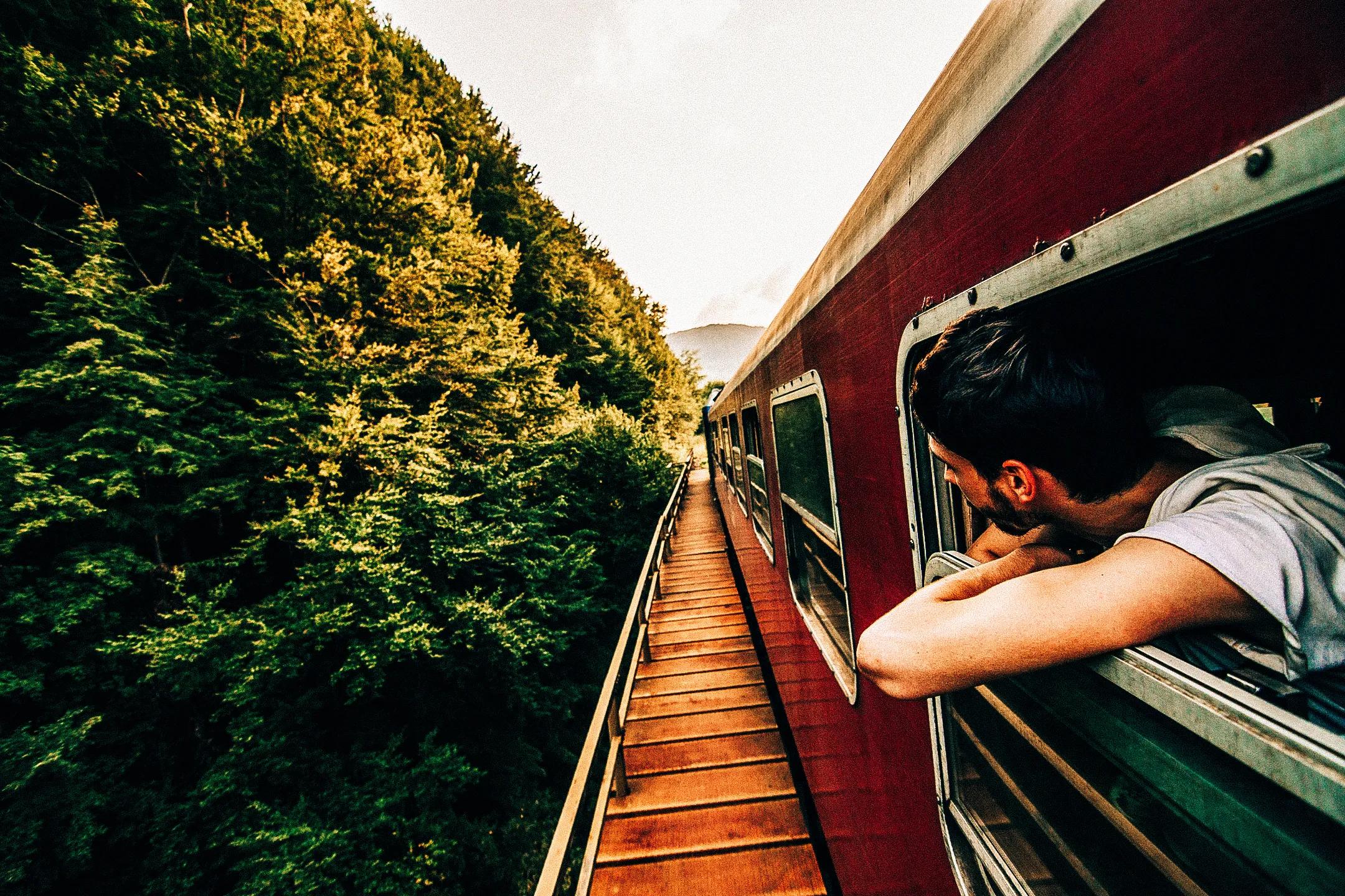 BOY ON RAILROAD TRACKS