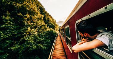 BOY ON RAILROAD TRACKS