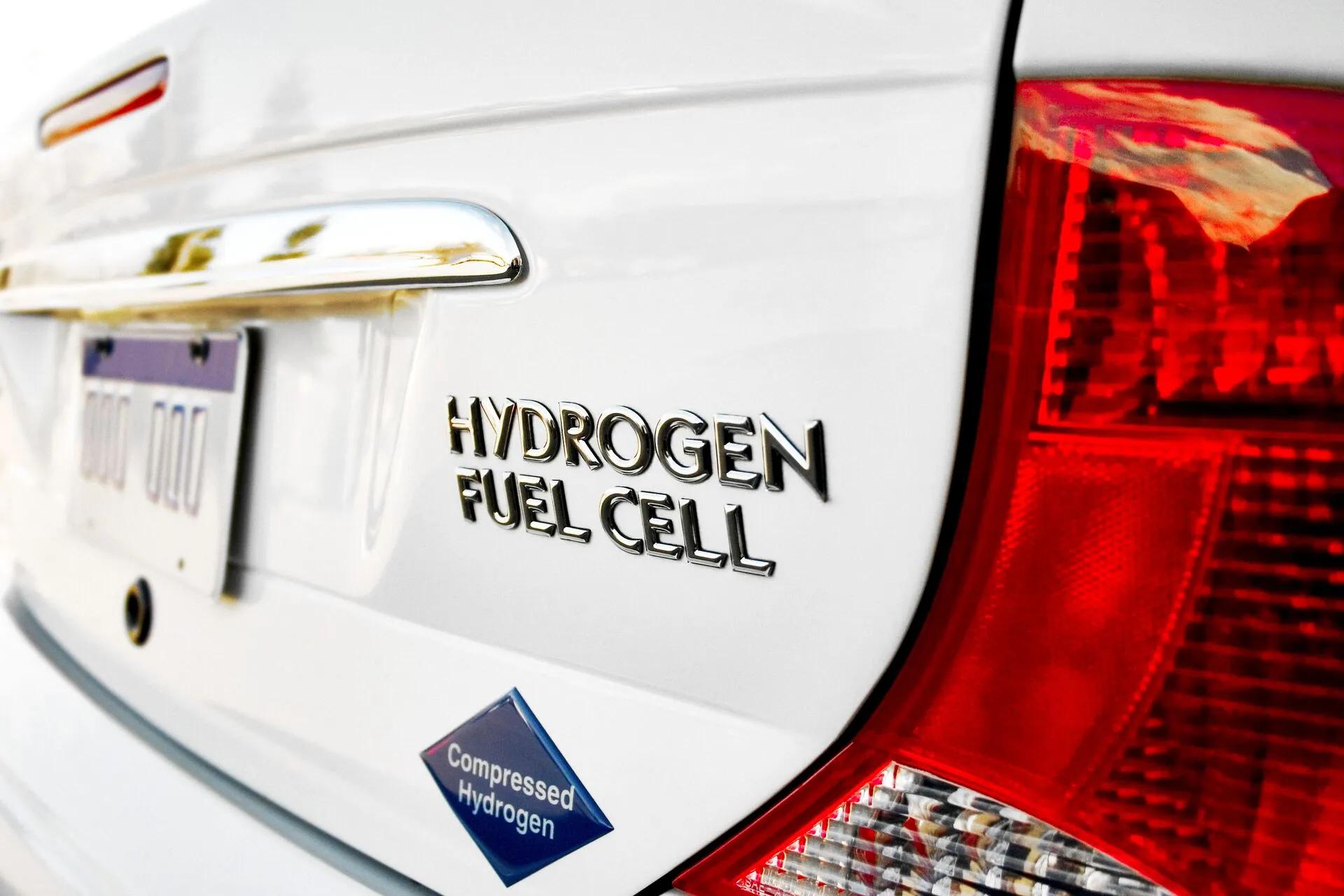 A header image showing a white car driving on hydrogen fuel cells, one of the highlights on the page.