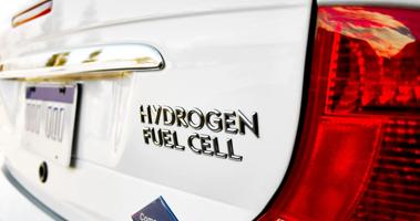 A header image showing a white car driving on hydrogen fuel cells, one of the highlights on the page.